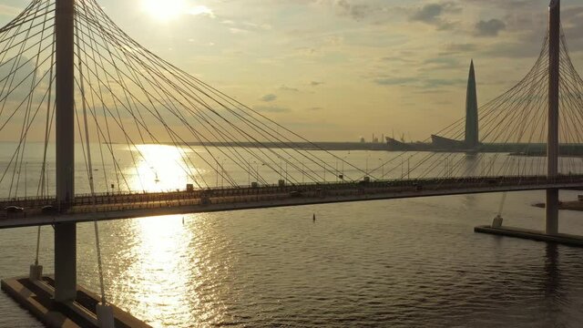 Aerial view of cable-stayed bridge and new skyscraper in St.Petersburg during sunset, 4k