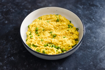 plant-based food, vegan turmeric ginger risotto with peas