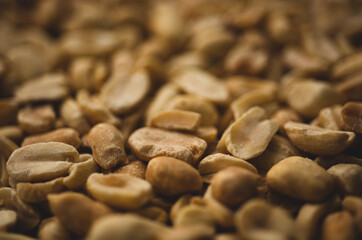 Macro close up portrait of organic peeled peanuts , studio lighting, selective focus