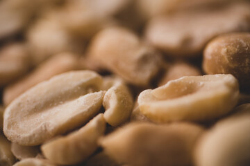 Macro close up portrait of organic peeled peanuts , studio lighting, selective focus