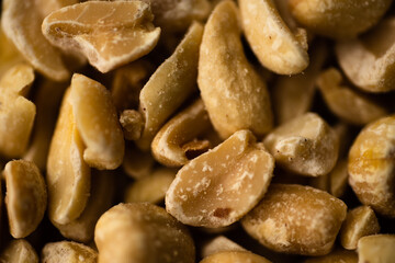 Macro close up portrait of organic peeled peanuts , studio lighting, selective focus