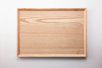 A square wood tray isolated white, top view at the studio.
