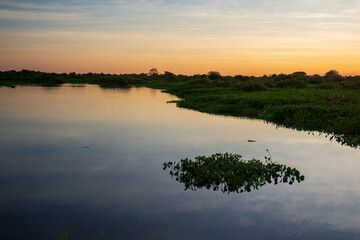 Fototapeta na wymiar Sunset on the banks of the transpantaneira road, in the Pantanal of the State of Mato Grosso close to Pocone, Mato Grosso, Brazil on June 14, 2015.