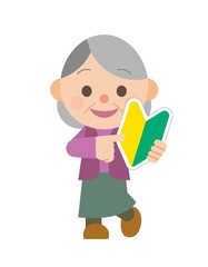 初心者マークを持った高齢女性