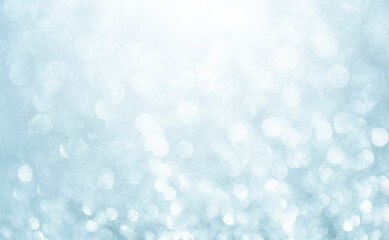 White glitter vintage lights background. Bokeh silver and white. defocused and copy space.	