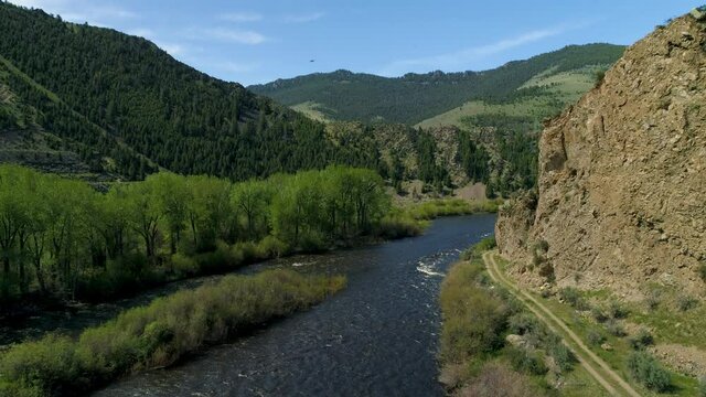 Aerial View of the river Maiden Rock Montana Landscape Mountain and roads with rocks at high noon from drone 