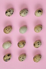 Quail eggs. Egg pattern.Quail eggs set on a light pink background.Egg 
protein. Natural bio farm eggs.Protein product. Keto diet.