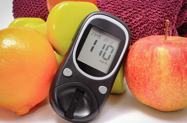 Glucose meter for checking sugar level, fresh fruits and dumbbells using in fitness. Healthy nutrition and sporty lifestyles