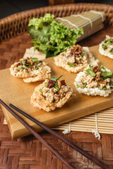 Creative food. Puffed rice and spicy minced pork salad on topping.
