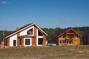 Fototapeta na wymiar New cottage village in field. Kazan, Russia