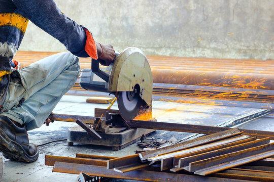 cutting of iron steel TMT bars with motorised steel cutter and generation of sparks