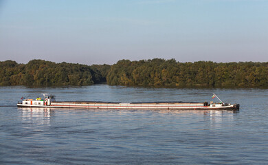 Fototapeta na wymiar Cargo ship goes on Danube river