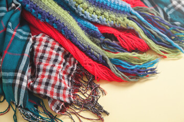 Colorful scarfes on yellow background.
