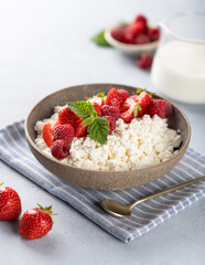 cottage cheese bowl with berries on a light background