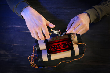 Man defusing bomb at table