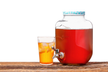 Jar and glass of fresh ice tea on table against white background