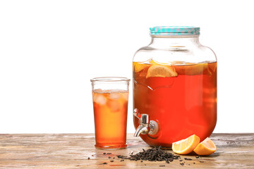 Jar and glass of fresh ice tea on table against white background