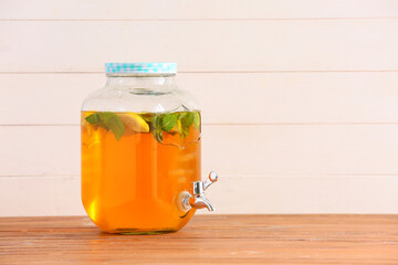 Jar of fresh ice tea on table