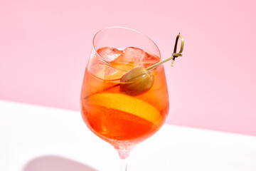 Aperol spritz on pink background
