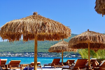 Bodrum, Turkey - August 2020: Hotel beach Lujo. Vacation in Paradise. Beautiful tropical beach banner. White sand travel tourism wide panorama background concept. Amazing beach landscape, yachts