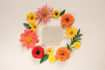 Top view of gift certificate box mock up in the centre of  floral wreath. Holiday background concept.