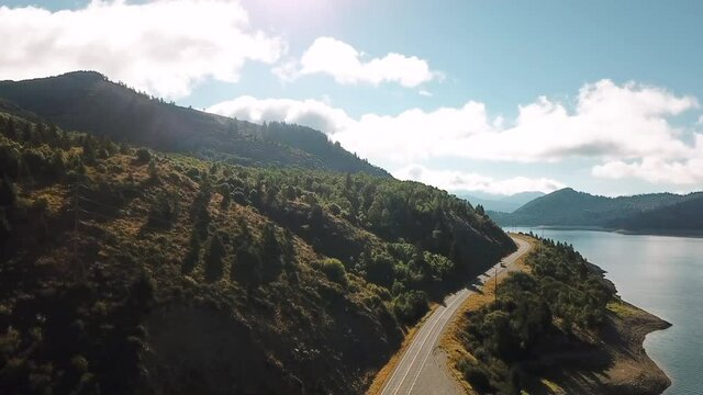Aerial Drone Video Flying Over a Winding Road, Lakes and Mountains in Idaho