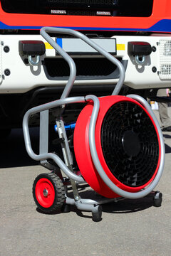 Mobieler fire brigade Smoke exhaust fan stands in front of a fire engine. High pressure fan.