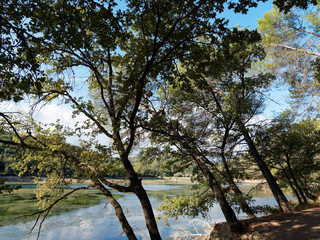 Nice out-and-back walk twisting along Carcès lake or lake of sainte Suzanne lined with trees and wildflower when the water level is low during dry period