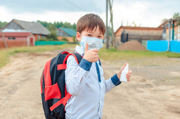 Fototapeta na wymiar Asian child boy student in school uniform medical face mask and sanitizer back to school epidemic Coronavirus, MERS-CoV, 2019-nCoV, quarantine, Covid-19 , new normal