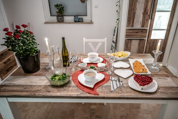 Valentines day dinner setting romantic love for two wooden table red heart shape candle light with roses