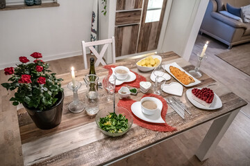 Valentines day dinner setting romantic love for two wooden table red heart shape candle light with roses
