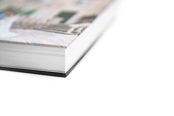close up. wedding photobook with thick pages on a white table. convenient, beautiful and...