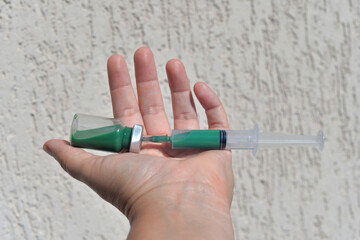 glass bottle for medicinal liquid, syringe with liquid