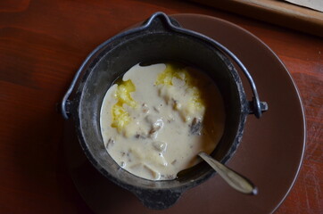 Hutsul banosh with white Carpathian mushrooms in a bowl
