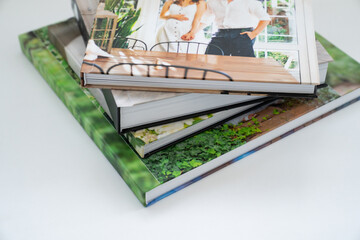a stack of photobooks. beautiful, convenient and long-lasting photo storage. decoration a...