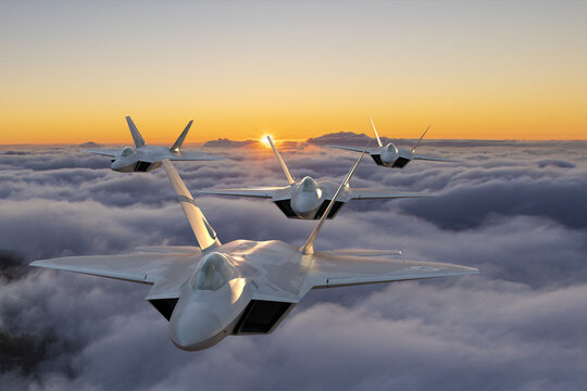 formation of the fifth generation :Lockheed Martin F-22 Raptor of the US Air Force in flight above the clouds