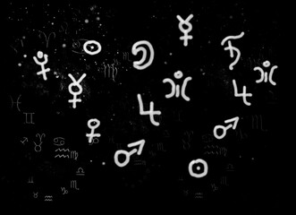 Symbols of planets and signs of the zodiac against the background of the cosmic sky
