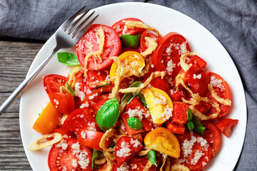 tomato salad with fried onion, quinoa and basil