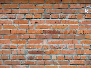 brick red wall of the barn for a brutal background in the loft