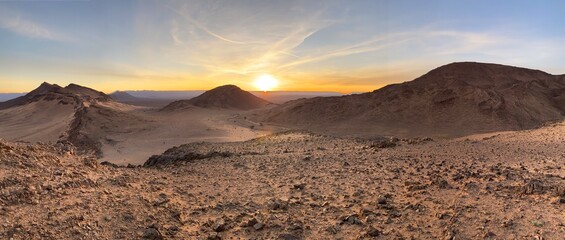 Sun between dunes