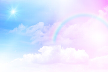 The Rainbow sky is Colorful sky with Soft clouds and a rainbow crossing. Fantasy magical sunny sky pastel background is fluffy white cloud. Freedom wallpaper concept. Sweet color dream.