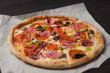 Closeup of freshly baked pizza in restaurant.