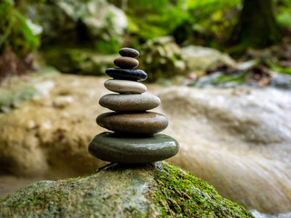 Fototapeta na wymiar Balanced Zen stones at the waterfalls