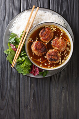Bun cha consists of rice vermicelli noodles (bun), grilled pork (cha) and a type of broth closeup...