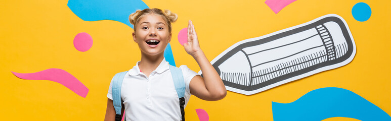 website header of excited schoolgirl raising hand and looking at camera on yellow background with multicolored paper artwork
