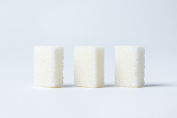 Refined sugar on a white background. White sugar cubes.