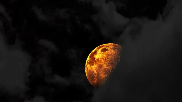 Half moon rise on the dark sky and gray cloud passing