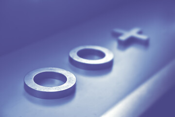 Symbol with a abstract backdrop of blue color. Two blue circles and a cross. Symbolic meaning of...
