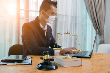 Male lawyer or judge wearing  protective mask on the consult having team meeting with client, Law and Legal services concept