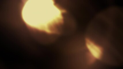 Light leaks on dark background. Slow motion. Realistic optical flare effect. Lens glow bokeh, dynamic blur. Color aberrations. Burst overlay 4K texture. For compositing your video, intro, transitions